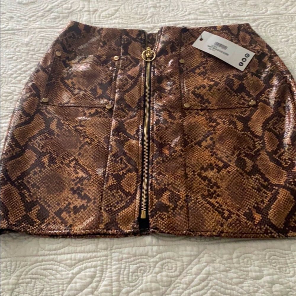 Faux snake print mini skirt.